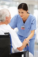 Man in a wheelchair with a nurse