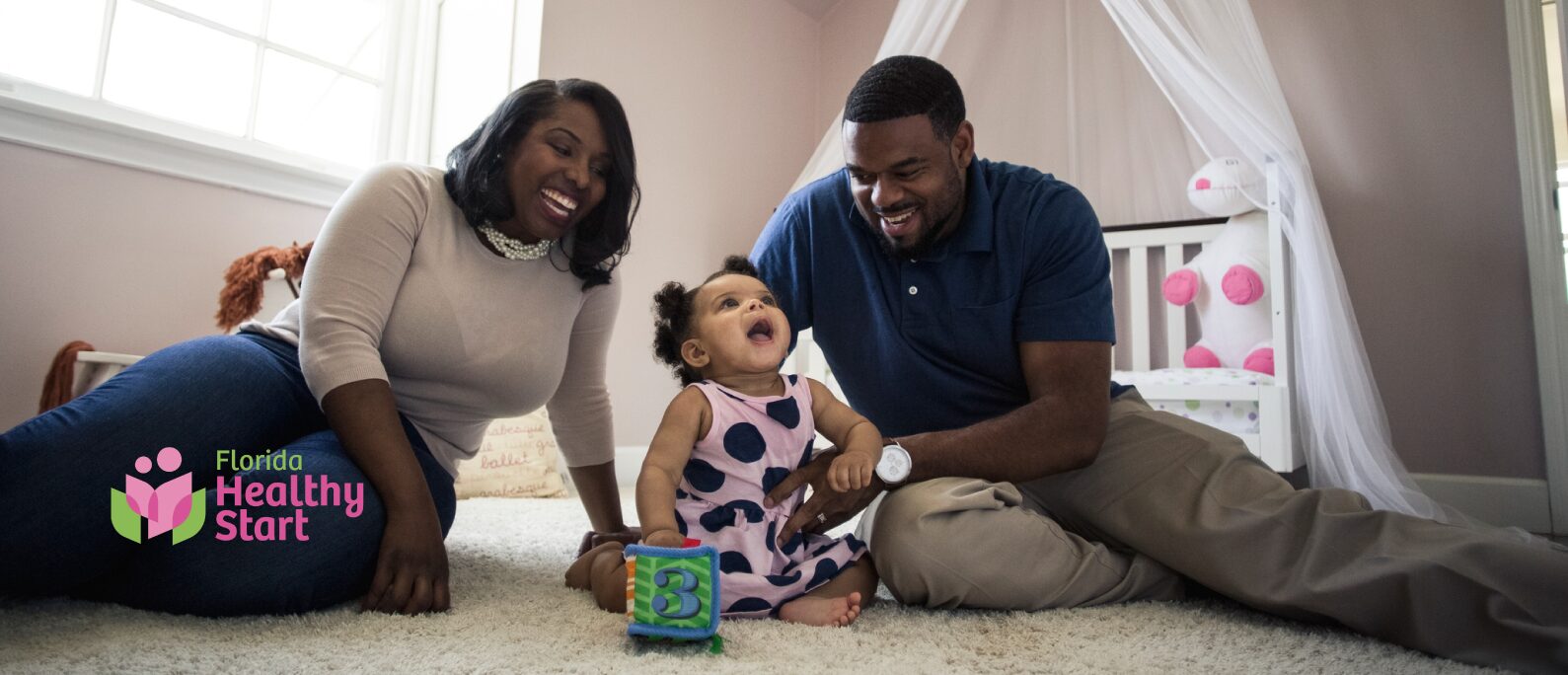 a mom and a dad playing with their child